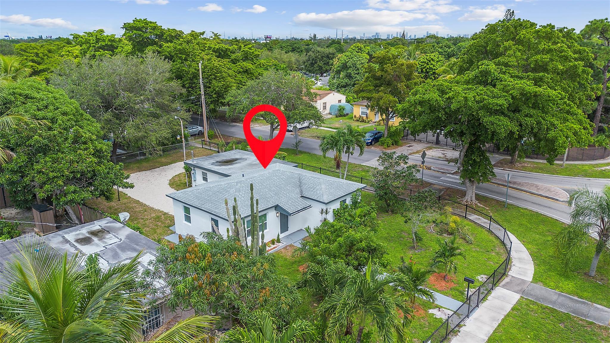Exceptional opportunity in Sunkist Grove, North Miami! This modern, renovated home with a private income-producing efficiency lets you live comfortably while earning passive income. Nestled on a large corner lot in the desirable Sunkist neighborhood, this property offers ample parking, privacy, and no HOA, making it ideal for boat or RV owners. Highlights include a newer roof, fresh interior and exterior paint, and lush tropical landscaping for unbeatable curb appeal. Inside, enjoy a chef’s kitchen with quartz countertops, stainless steel appliances, and custom cabinetry. The home features modern tile flooring, designer bathrooms, and bright open-concept living spaces filled with natural light. It is conveniently located near I-95, shopping, dining, and beaches.