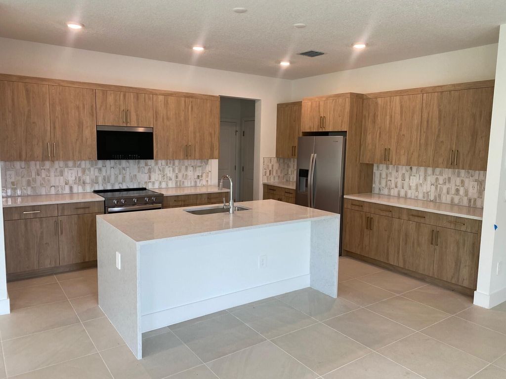 Photo of 6880 SE Park Trace Drive, Stuart, FL 34997 (MLS # R11106378)