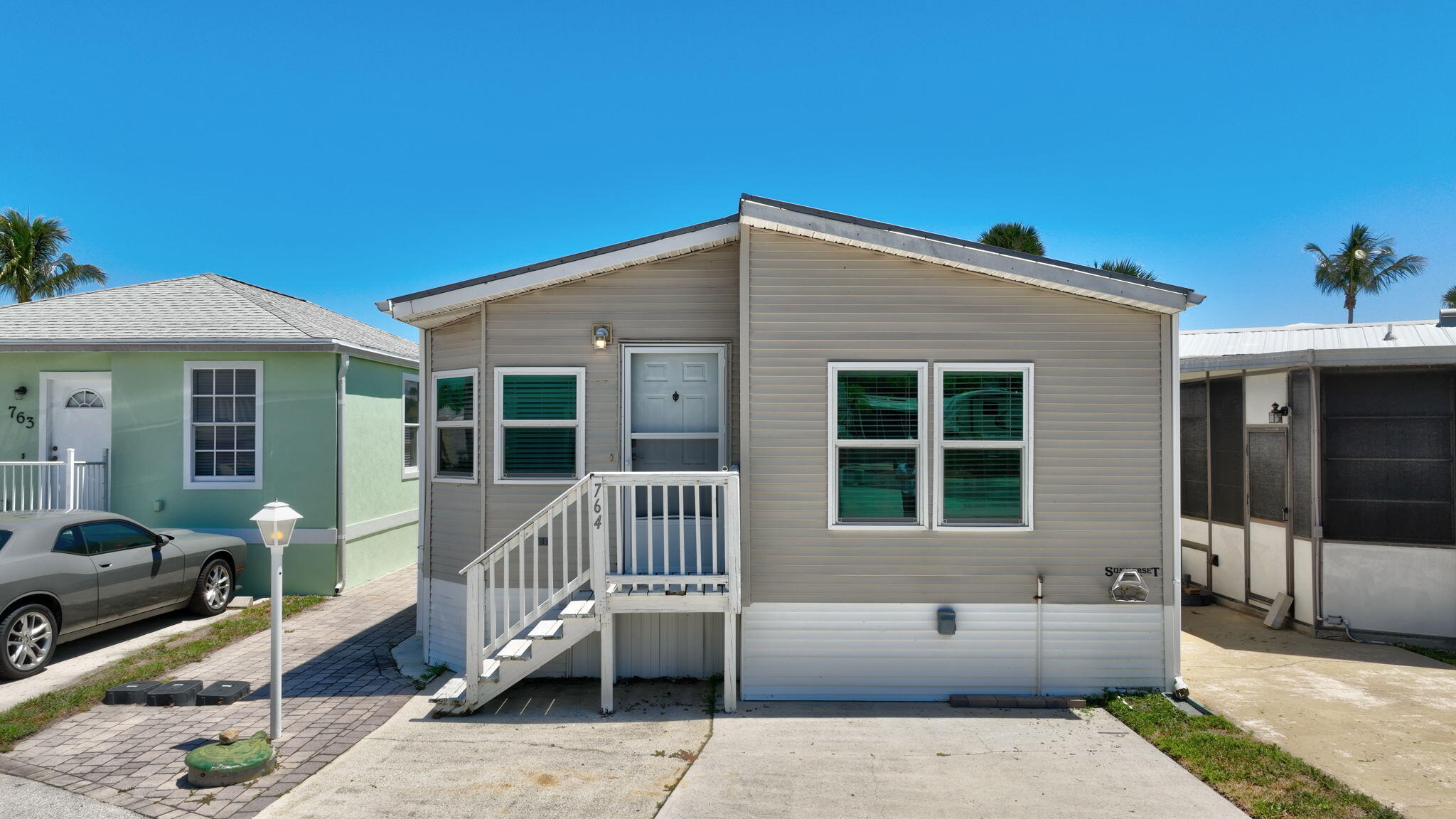 Welcome to your perfect coastal escape! This fully renovated, turnkey cottage in Jensen Beach, FL! Move-in ready with stylish, contemporary furnishings included--down to the linens-- with IMPACT WINDOWS & METAL ROOF this charming retreat lets you start living the Florida dream the moment you step inside, just steps from the pristine Atlantic Ocean. Impeccably redesigned, this cottage boasts an open-concept layout bathed in natural light, featuring a spacious kitchen with stainless steel appliances, and cabinetry--perfect for entertaining or relaxing after a day at the beach. The cozy yet modern living spaces flow seamlessly to outdoor areas, ideal for enjoying ocean breezes and vibrant sunsets.
