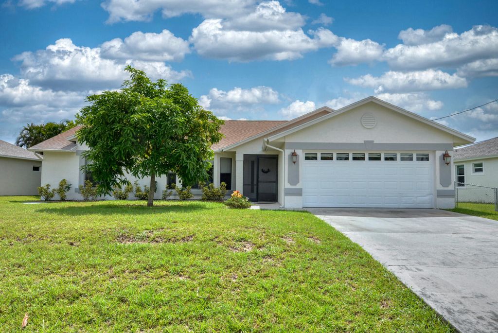 Photo of 6711 NW Dorothy Street, Port Saint Lucie, FL 34983 (MLS # R10813121)