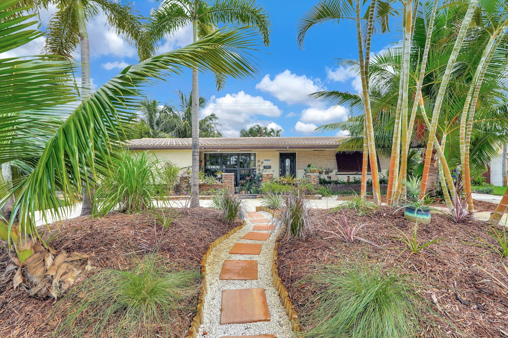 This exceptional home combines timeless care with inviting spaces both inside and out. Lovingly maintained by the same owners since 2003, this home spans over 2,000 S/F and offers a versatile layout including an office and Florida room. The modern kitchen blends style and function, while the home’s thoughtful design ensures comfort for both everyday living and entertaining. Outdoors, the home truly shines. The backyard has been transformed into a private oasis with options for relaxing, dining, or entertaining guests. A sparkling pool takes center stage, framed by lush, mature landscaping that provides beauty, shade, and privacy. Whether you’re hosting gatherings, enjoying quiet mornings, or unwinding at the end of the day, the backyard offers a resort-like setting all your own.