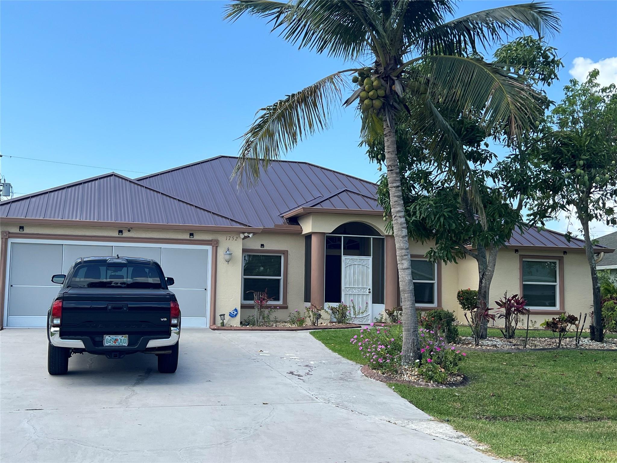 In the heart of SW Port St Lucie minutes to I95 & Tradition. A home that brings you joy, security, room for growth and large gathering spaces. CBS construction with impact windows and Metal Roof for peace-of-mind. A roomy Primary ensuite and 3 Guest rooms that may serve a large family or guest quarters. Search no more. Spacious single family home with Granite countertops, SS appliances, large kitchen, plenty of cabinet space. Oversize enclosed patio for family gathering, outdoor cooking Desire an oversized 2-car garage There's SO many value-added features and no HOA . Window Replacement 2024, New Metal Roof 2023, New AC and Water Heater installed June 2025
