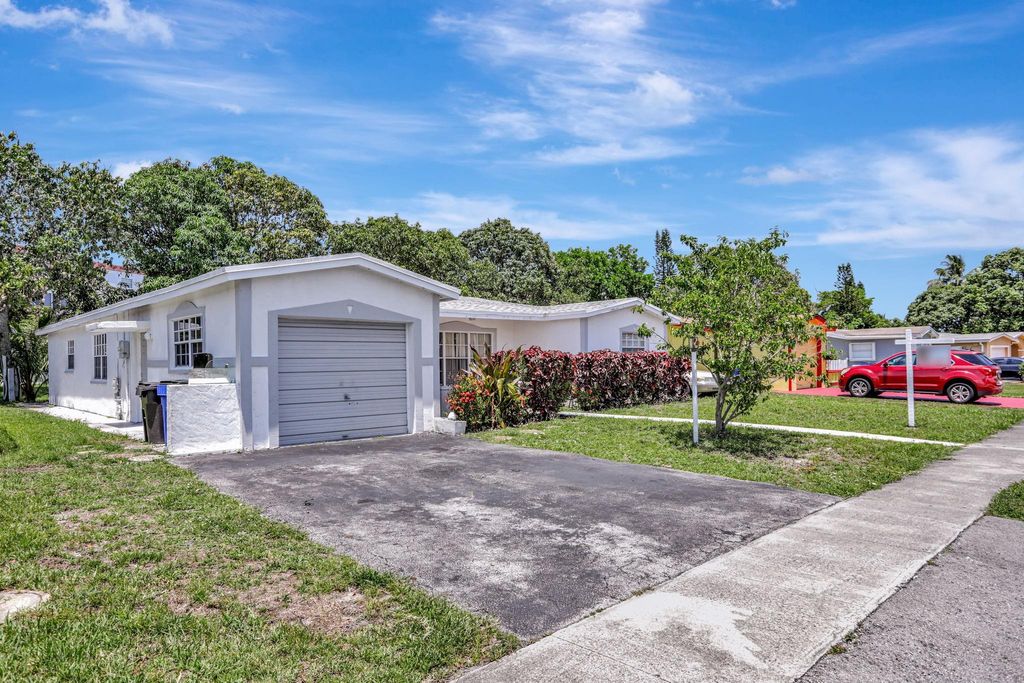 Photo of 3960 NW 45th Avenue, Lauderdale Lakes, FL 33319 (MLS # F10505412)
