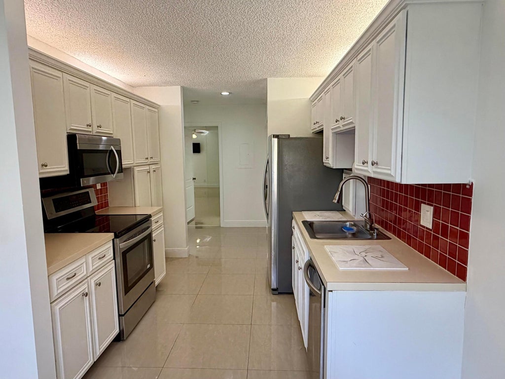 Photo of 2622 N CARAMBOLA Circle N #1708, Coconut Creek, FL 33066 (MLS # B26092346)