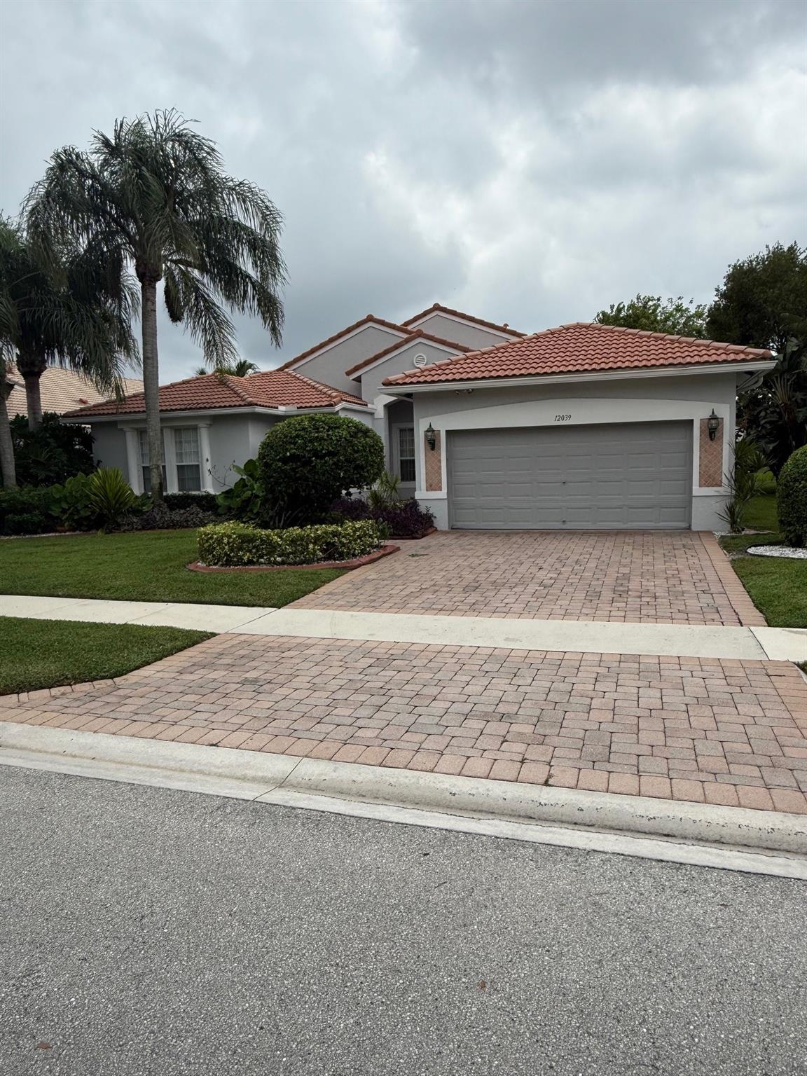 VACANT Owner moved! Rare four bedroom home on lake in central Boynton Beach in gated community of Avalon Estates. Just painted with neutral colors shows bright and welcoming with split floor plan. Largest model with two walk-in master his and her closets. Granite countertops in open kitchen. Two newer AC units and washer dryer. New Hot Water heater. Large patio/porch great for entertaining outdoors. Redecorated clubhouse with pool, spa, fitness center, pickleball and tennis courts. billiards, theater. Perfect for active adults! Homes are painted every seven years by HOA! 55+ neighborhood