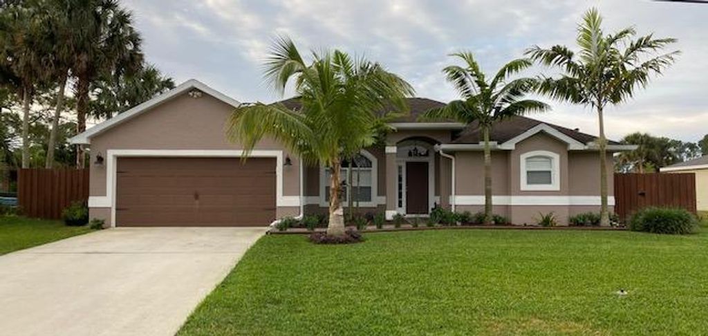Photo of 1852 SW Macarthur Avenue, Port Saint Lucie, FL 34953 (MLS # R10698116)
