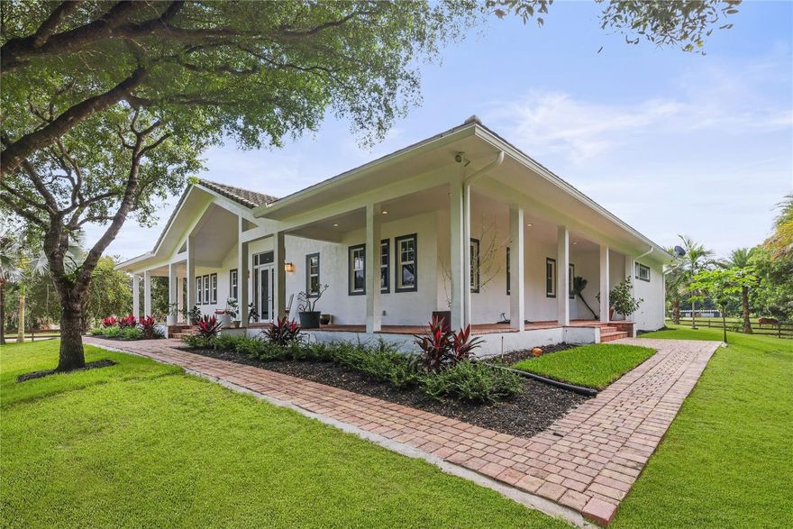 STUNNING 2015 CUSTOM-BUILT RANCH HOME IN PRESTIGIOUS SUNSHINE RANCHES, SET ON OVER 2 ACRES WITH 4 BEDROOMS, 2.5 BATHS, A 6-STALL FLORIDA BARN, AND 2 DETACHED SHEDS. BUILT WITH POURED CONCRETE WALLS, IMPACT WINDOWS/DOORS, AND AN ENCAPSULATED ATTIC FOR ENERGY EFFICIENCY. INTERIOR HIGHLIGHTS INCLUDE WOOD-LOOK PORCELAIN FLOORS, SOARING CEILINGS, A GOURMET KITCHEN WITH SUBZERO & THERMADOR APPLIANCES, CUSTOM CABINETRY, AND ITALIAN TILE BATHS. LIVING ROOM/GREAT ROOM OPENS TO SERENE VIEWS OF THE LAND AND HORSE FIELD. OUTDOOR FEATURES INCLUDE A PROPANE FIRE PIT, FENCED/CROSS-FENCED GROUNDS, AND A GRADED LOT. HOME INCLUDES MANUAL TRANSFER SWITCH WITH GAS GENERATOR. THOUGHTFULLY DESIGNED AND METICULOUSLY BUILT—EASY TO SHOW!