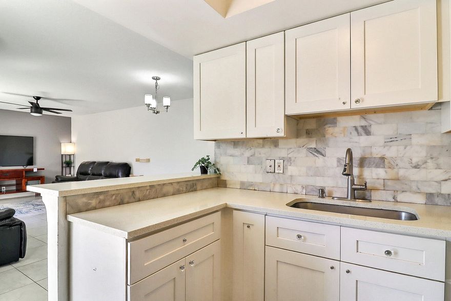 BEAUTIFUL CORNER END-UNIT TOWNHOUSE | HIGHLY DESIRABLE CHATEAU WOOD | TRANQUIL GARDEN VIEWS | Bright Open Floor Plan | Upgraded Lighting | Tile Floors | Tray Ceilings | Balcony | Remodeled Eat-In Kitchen with Breakfast Bar | Quartz Counters | White Wood Cabinets | New Dishwasher | S/S Appliances | Primary And 2nd Bedrooms With Balcony Access And En-suite Baths | Bonus 1st Floor Bedroom And Bath | Washer/Dryer Inside | Tropical Landscaping | Private Fenced Patio | Resort-Like Amenities Offer Pool & Tennis Courts | Assigned & Guest Parking | Prime Delray Beach Location | Minutes to Beaches, Downtown Atlantic Ave, Shopping, Fine Dining & More | Top A+ Rated Schools | Roof 2012 | AC 2024 | Roof Covered By HOA | PRESENT ALL OFFERS!