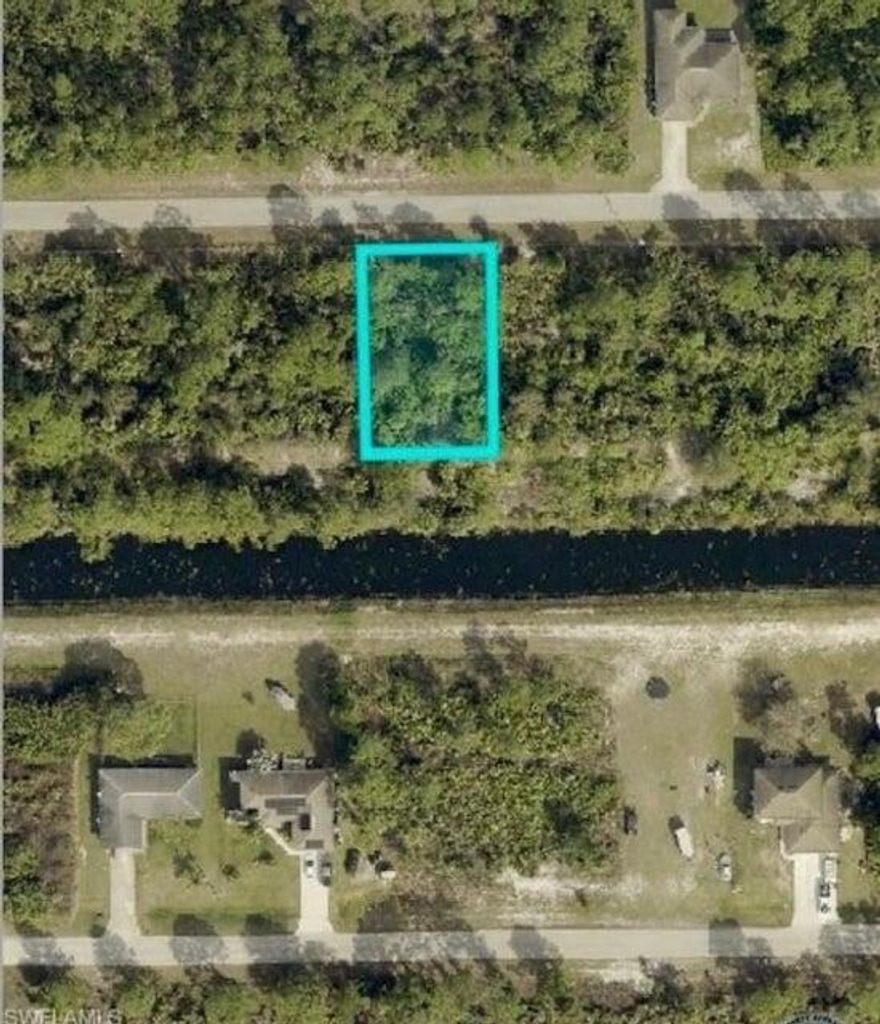This .25 acre lot in the east section of Lehigh Acres is high and dry, on a paved road and backs along a canal for extra privacy. All of this for under $19,000 is very rare in the city. You can enjoy many activities within a short drive such as shopping, JetBlue Stadium (home of the Red Sox spring training), Hammond Stadium (home of the Twins spring training) and Fort Myers Beach. Also for added convenience, Southwest International Airport is quick drive away, Don't miss out!