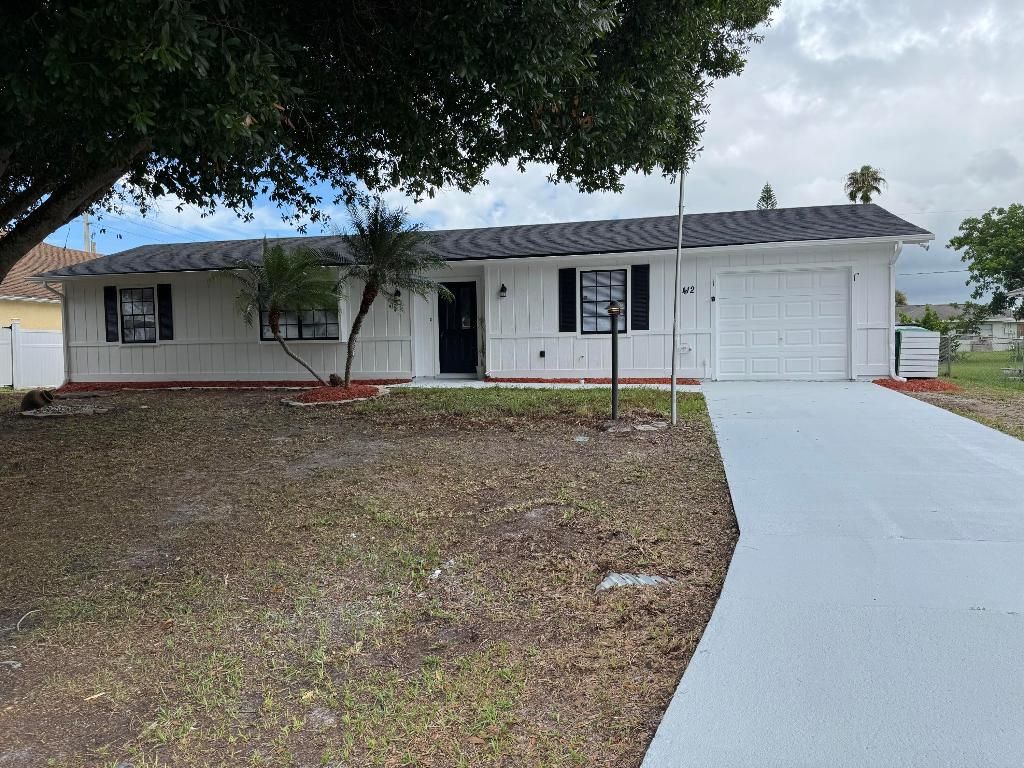 Photo of 412 NE Midvale Street, Port Saint Lucie, FL 34983 (MLS # R11103016)
