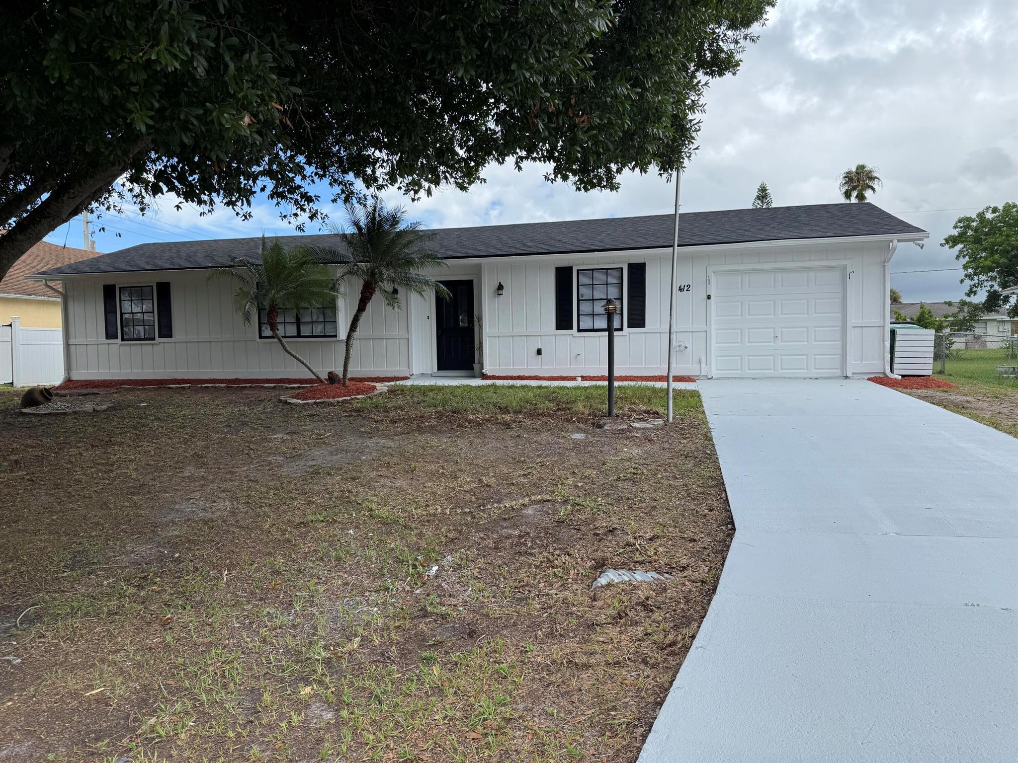 Outstanding location! Just off Saint Lucie West and Airoso and minutes away from Crosstown, I-95, Turnpike, Mets stadium, beaches, fine restaurants, shops and more...! All nearby! Come see this 3/2/1 completely remodeled from top to bottom home! It comes with a brand new roof - just replaced. It also comes with beautiful white shaker cabinets and gorgeous quartz countertops/backsplash and newer stainless steel appliances. It also has brand new waterproof luxury vinyl planks and baseboards throughout the whole house, brand new vanities with quartz countertops, brand new tile in both bathrooms, water/lighting fixtures throughout the whole house, new ceiling fans, outlets/switches and the list goes on...! It's been freshly painted inside-out; including epoxy paint in