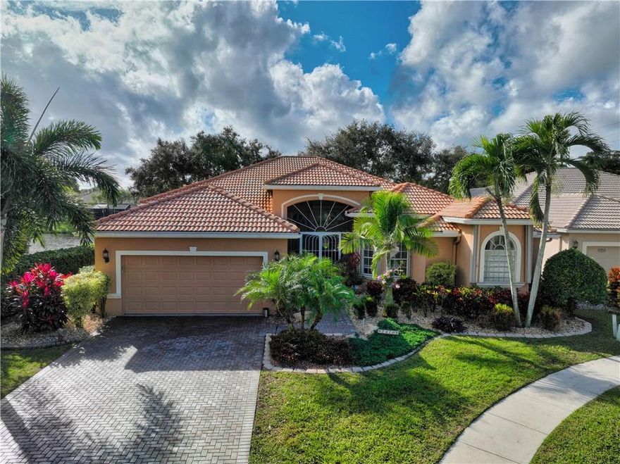 Exquisite water view and beautiful landscaping make this home inviting and desirable to own. This is the largest model in Villa Borghese and includes a formal living room and dining room for those social occasions when you need that extra space to accommodate friends and family. This home boasts a dining area and den adjacent to the kitchen for the casual lifestyle of Florida.