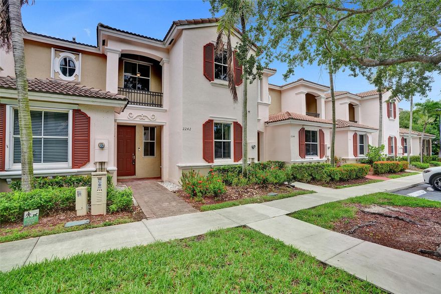 Beautiful 4 bedroom Townhouse in the prestigious Waterstone Community/Marbella Cove. The main level includes a  full bathroom and bedroom along with kitchen that offers a walk-in pantry, white cabinets and butcher block counters, plus a pass through window to dining and living area. This home features rich espresso wide plank flooring-low maintenance,modern luxury, volume ceilings, and a private fenced backyard with storage. Enjoy resort-style amenities including multiple community pools, clubhouse, gym, playground, and 24/7 security. Prime location near highways, hospitals, dining, and shops. LOW HOA. A perfect blend of comfort, style, and convenience.