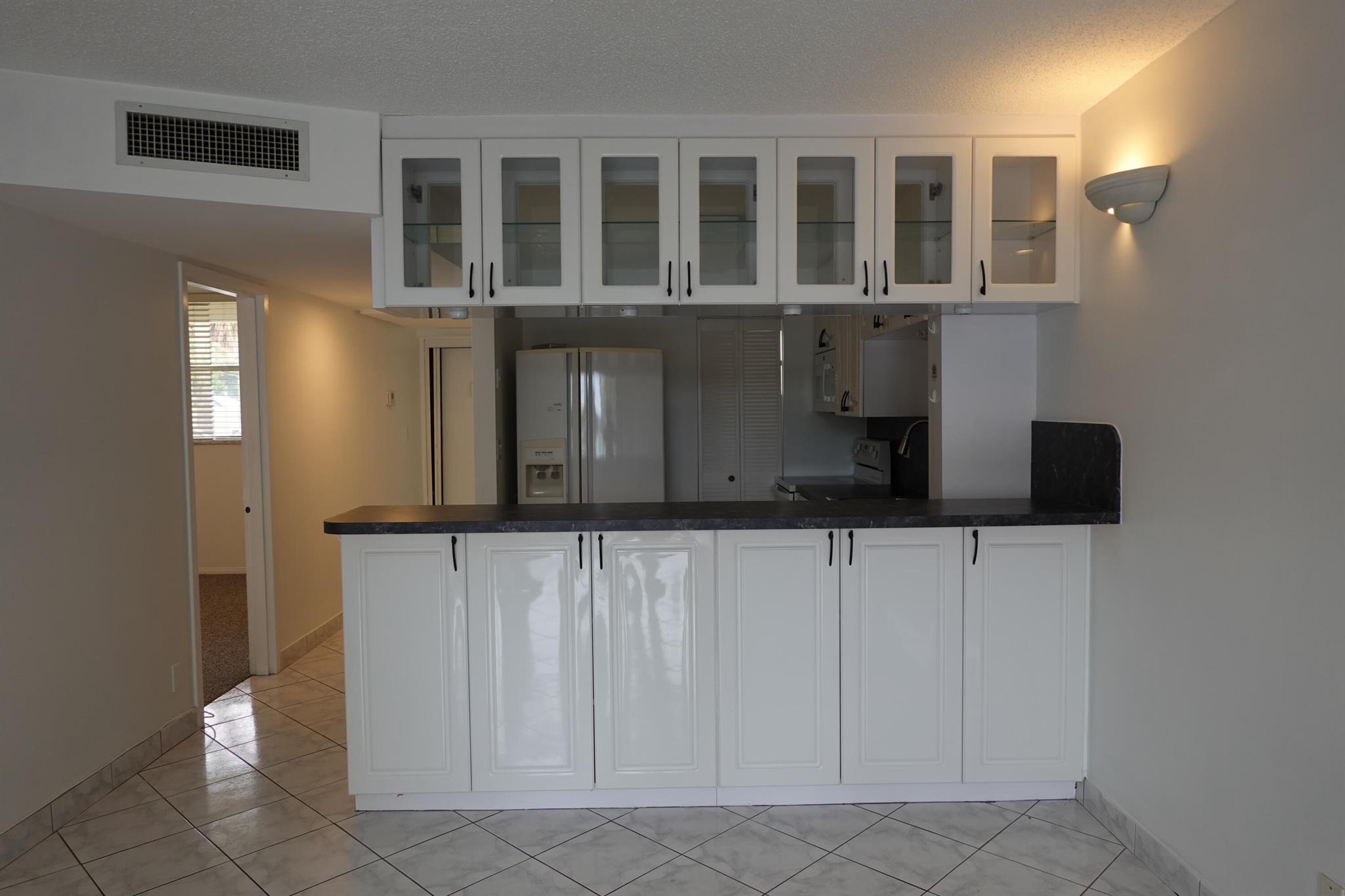Welcome to Cross Fox Condominium, resort-style oasis in Fort Lauderdale's Landings neighborhood. This 1-1.5 unit offers brand new carpet, updated kitchen fresh paint tons of storage in the kitchen. Enjoy a cozy screened patio and unwind. The Cross Fox community features a heated pool, hot tub, fitness center, sauna, clubhouse, tiki bar, BBQ areas, and lush courtyards with waterfalls and lagoons perfect for a vibrant, social lifestyle.