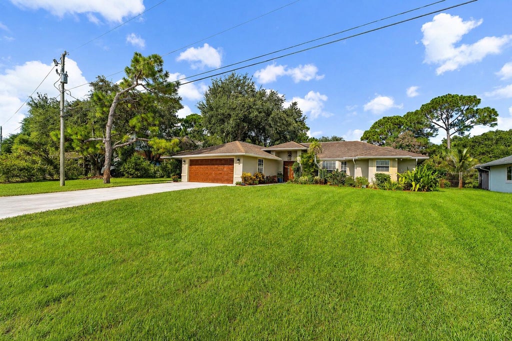 Photo of 4120 SW BELSHAW Street, Port Saint Lucie, FL 34953 (MLS # B26069290)