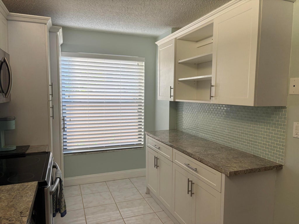 Photo of 1424 NW 97TH Terrace #280, Pembroke Pines, FL 33024 (MLS # B26090127)