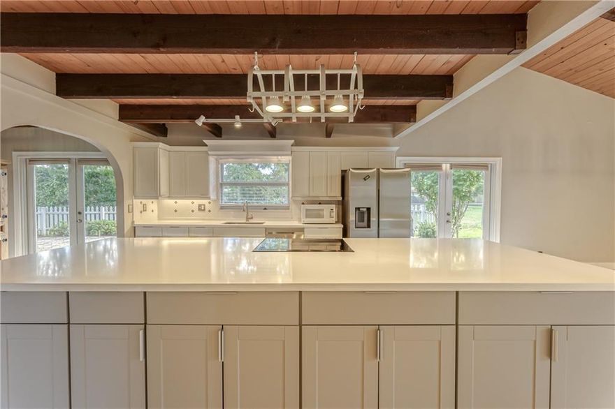 LARGEST Home in West Boca with lowest price per square foot. This home is Move in Ready!  IMPACT windows and Low HOA! Sought after Logger's Run Family community. Low HOA fee's this is a large 5 bedroom home! From the moment you enter this one of a kind home you will notice the beautiful vaulted ceilings with exposed beams & cedar planks. This open floorplan is perfect to entertain with a formal living room, dining area & a family room. The open kitchen provides tiled countertops, tiled backsplash, a center island and a breakfast nook. Spacious main retreat features French doors and an updated bath with a walk-in shower. Also located on the first floor are two additional bedrooms. Custom staircase leads to two additional bedrooms and a large loft. Newer A/C, newer roof! CALL LISTING AGENT!