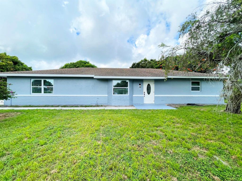Photo of 702 NE Lanfair Street NE #A, Port Saint Lucie, FL 34983 (MLS # R10998796)