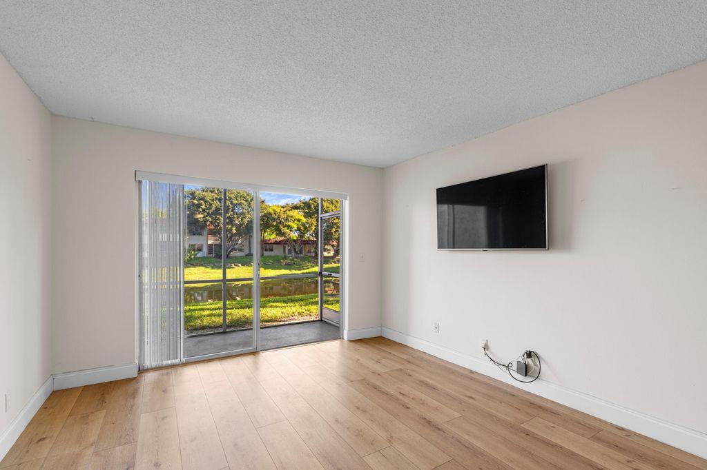 Photo of 123 Lake Carol Drive, West Palm Beach, FL 33411 (MLS # B26006704)