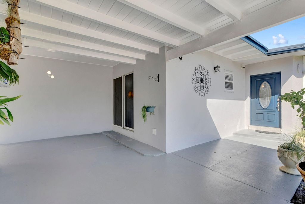 Photo of 309 Henthorne Drive, Palm Springs, FL 33461 (MLS # R10962849)