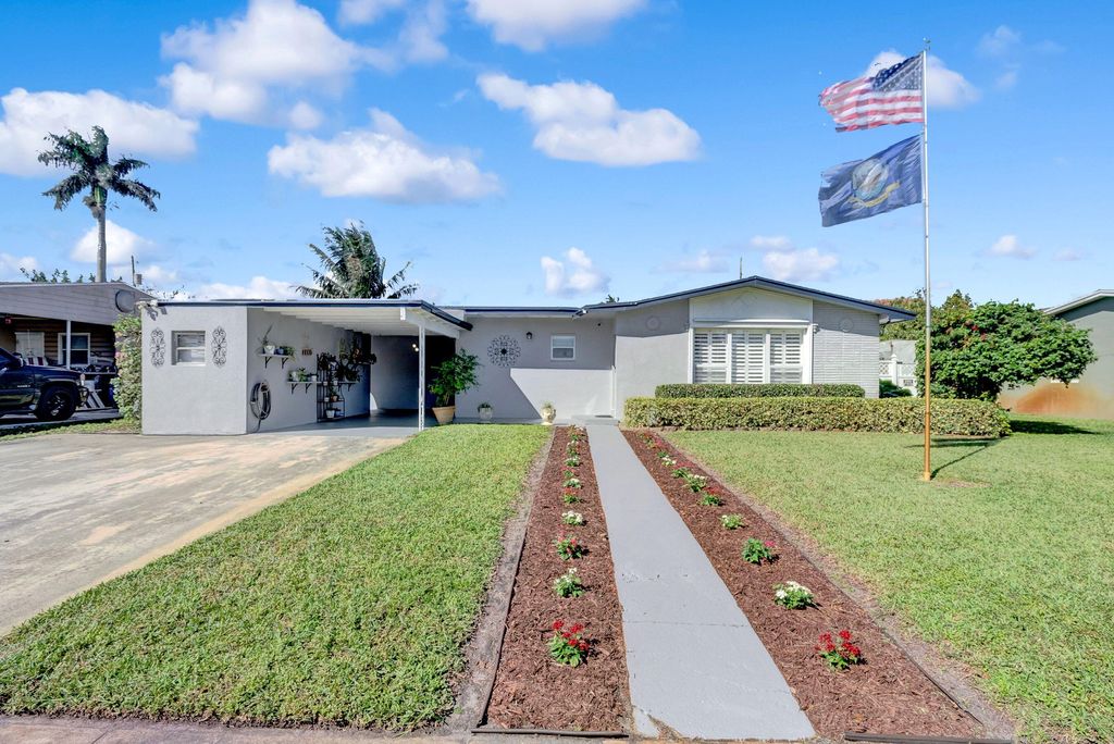 Photo of 309 Henthorne Drive, Palm Springs, FL 33461 (MLS # R10962849)