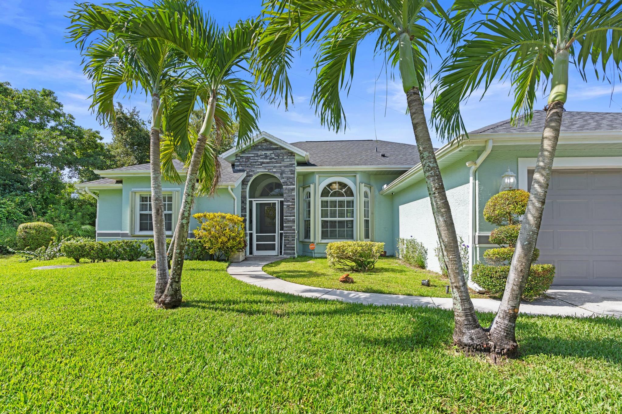 This is the one you've been waiting for - a rare opportunity to own a spacious single-family home on a generous quarter acre lot, right in the heart of Port Saint Lucie. Offering over 2,000 square feet of living space, this 4-bedroom home is loaded with value and ready for you to move right in.Enjoy peace of mind with all major systems recently updated: new roof, new A/C, and new water heater. The entire home is hurricane protected, offering both security and insurance savings.