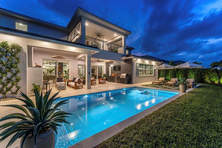 Exclusive Langford Landing Enclave! 40FT BOAT SLIP! Perfectly oriented with preserve vista, impossibly private in feel. Soaring 2-story foyer entry.  Open concept, with distinct spaces, including living, dining, and dedicated office. Designer custom kitchen, with large island, and butler pantry. Downstairs Main Suite with custom His/Her closets, pass-thru shower, & spa tub. Upstairs, 4 guest beds with en suite baths, living area, and wide balcony. Full impact glass, Sonos system, integrated security, up/down laundry, 24kw generator/500 gal tank.  2024 new saltwater pool, outdoor living rm w/gas fireplace, modern outdoor kitchen. True 3 car garage for enthusiasts, w/ custom cabinetry and rod storage.  Residence has private 40FT boat slip & 24k lift at on-property marina.