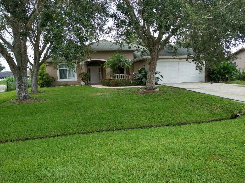 Photo of 573 NW Azine Avenue, Port Saint Lucie, FL 34983 (MLS # R11098381)