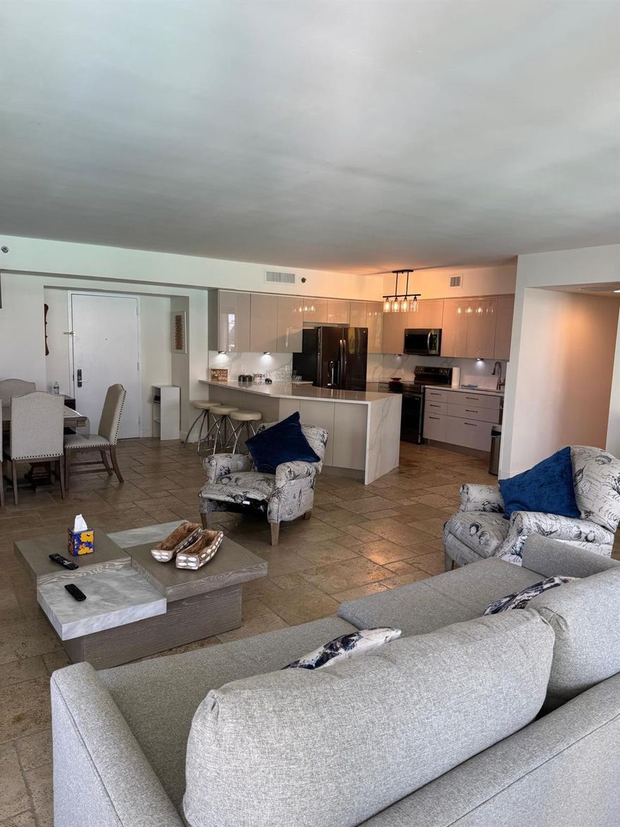 Beautifully furnished corner residence spanning 1,782 sq. ft., featuring 2 bedrooms, 2 bathrooms, and wraparound balconies totaling more than 450 sq. ft. The primary suite includes a king bed, while the second bedroom offers a queen. This desirable Model C northeast corner unit showcases breathtaking ocean and Intracoastal views from two private balconies. Elegant details include a Jacuzzi tub in the master bath and a renovated European-style kitchen with top-notch quartz countertops and premium appliances. Residents enjoy resort-style amenities such as infinity-edge pools, a full-service spa, and a 50,000 sq. ft. oceanfront fitness center.