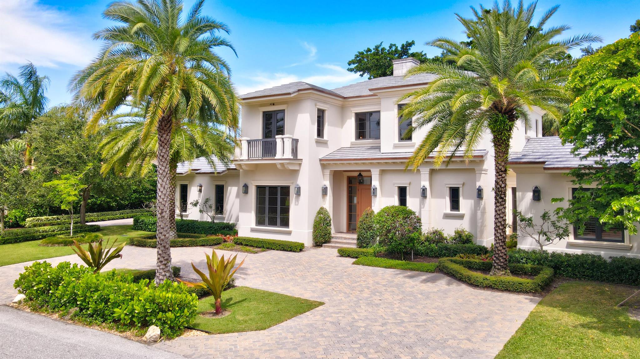 Classic Coastal construction custom residence nestled on a quiet cul-de-sac street, walking distance to the ocean and intracoastal waterway. Modern elegance with a clean line transitional design, showcasing decorative ceilings, detailed moldings and rich hardwood floors. A first floor primary suite, additional bedroom/office with two second floor ensuite bedrooms plus an entertainment/game area. Built by Seaside Builders and architecturally designed Richard Jones.