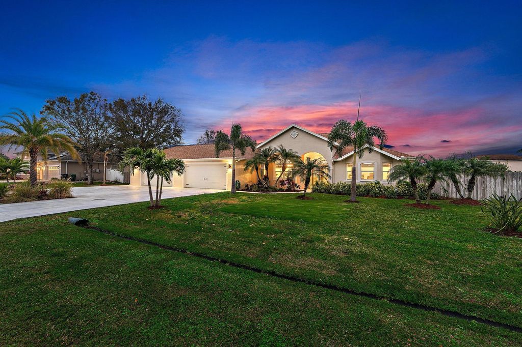 Photo of 5884 NW Carovel Avenue, Port Saint Lucie, FL 34986 (MLS # R10959226)