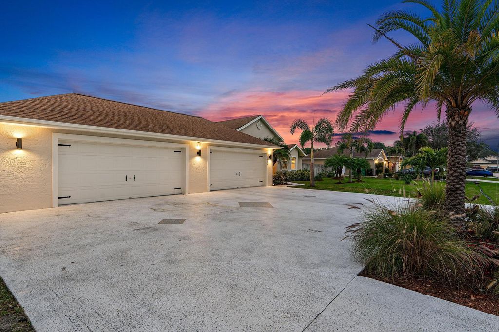 Photo of 5884 NW Carovel Avenue, Port Saint Lucie, FL 34986 (MLS # R10959226)