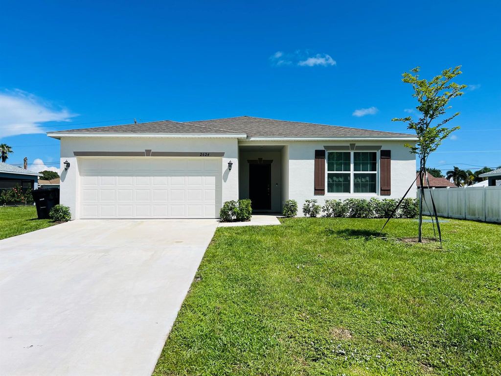 Photo of 2624 SW Ann Arbor Road, Port Saint Lucie, FL 34953 (MLS # R11119705)