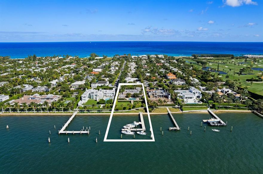 Magnificent Lake Front Regency situated on high elevation with amazing panoramic views!! Deep water concrete dock which can accommodate up to a 130' yacht and includes a 40k lb lift and a 15k lb lift for smaller boats. Private deeded beach access! Spacious floor plan features high ceilings, 5 bedrooms, 6.5 baths, 2 kitchens, 2 offices, media room, billiards room, 4 bars, several water features inside and outside, Gas fireplace, oversized travertine pool terrace and covered loggias perfect for entertaining!!