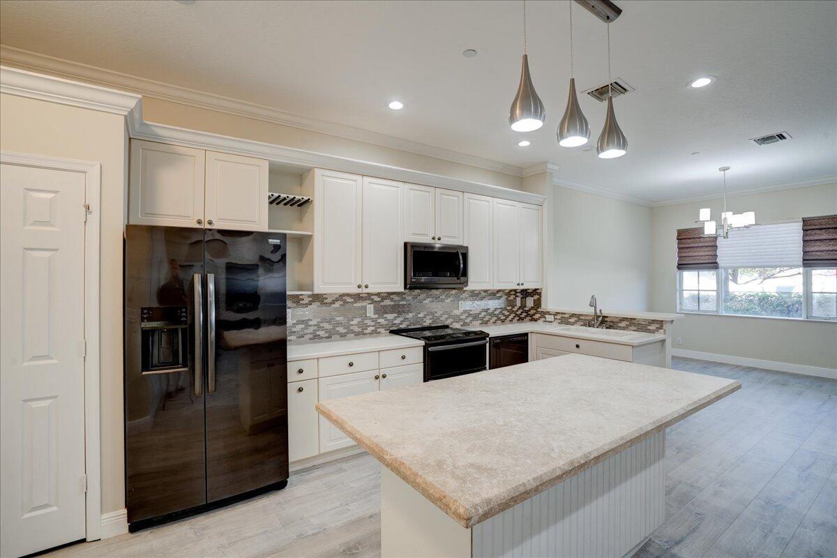 With the perfect blend of style space, and convenience, nestled in the Carriage Pointe community in Boynton Beach, this 2-story townhome is 10 minutes from the sun-soaked beaches and nightlife of Atlantic Ave in Delray Beach. Only minutes from schools, shopping and entertainment. For additional fun and relaxation, you have a community pool and kiddie playground. 2,209 sq..ft of open living space, with 3 generously sized bedrooms, a large versatile loft, and 2.5 baths. The primary suite boasts a redesigned spa like bathroom with a walk-in shower, separate soaking tub, and dual vanities.