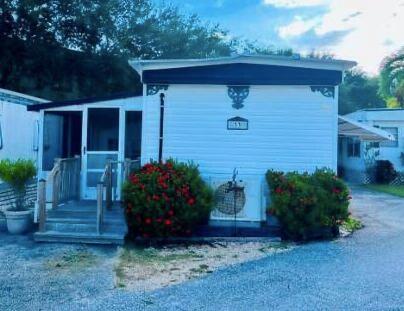 One of the Last Remaining 55+ Intracoastal Manufactured Home Communities!Don't miss this rare opportunity to own a beautifully maintained 2-bedroom, 1-bath manufactured home just 50 yards from the beautiful private beach on the Intracoastal. Nestled within one of the last 55+ communities along the Intracoastal Waterway, this gem offers unbeatable value, lifestyle, and location. This community is immaculately manicured and well cared for, offering a quiet yet semi-active lifestyle for its residents.Step inside to discover a bright and spacious open-concept layout, perfect for entertaining or relaxing. The front living area flows seamlessly into a screened-in patio and an enclosed lanai, providing flexible indoor-outdoor living space to enjoy the South Florida breeze.