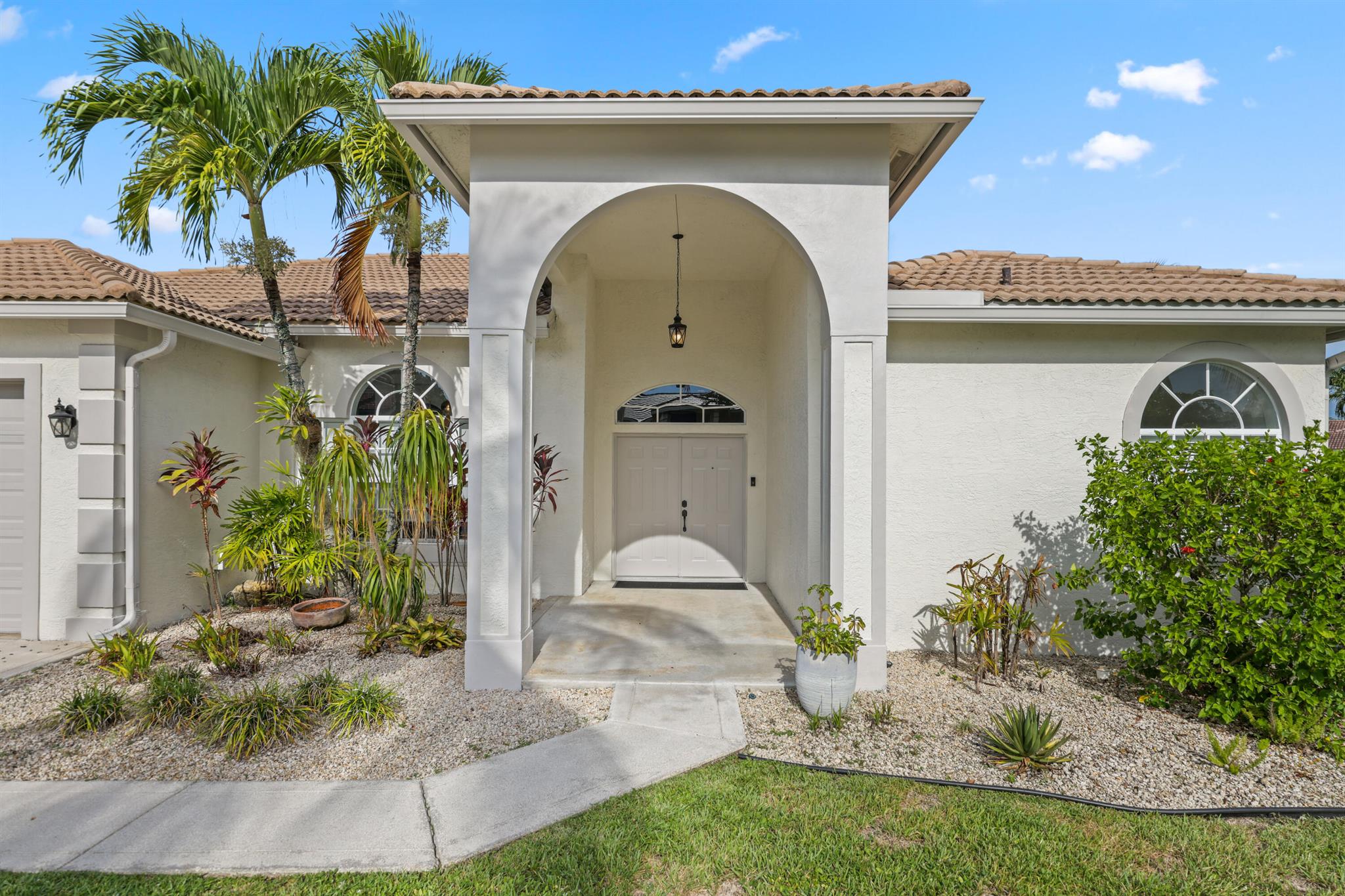 Welcome to this rare gem tucked inside the highly sought-after Lacuna Golf & Country Club, a non-equity membership community where resort living meets everyday comfort. This spacious 4-bedroom, 2.5-bath residence sits proudly on a large corner cul-de-sac lot, offering both privacy and curb appeal.Step outside and discover your own private oasis: a 15x30 saltwater pool with a tranquil waterfall feature, a sun shelf for lounging, and a gorgeous travertine deck. Entertain in style.Inside, this home is brimming with character -- from the beautiful custom paintwork and artistic touches to the decorative ceilings that grace the main living areas and primary suite. . The chef-inspired kitchen boasts granite countertops, a breakfast bar, and stainless steel appliances, opening seamlessly to a