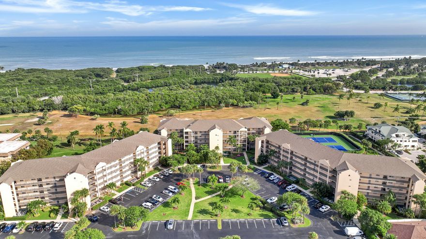 LOCATION! LOCATION! LOCATION!  ONE OF THE BEST UNITS IN JUPITER BAY!  IF YOU'RE LOOKING IN JUPITER BAY, THE TOWN OF JUPITER OR THE PALM BEACH COUNTY AREA - YOU MUST SEE THIS PROPERTY! 
This NEWLY remodeled 2 bedroom 2 bath corner-unit condominium is set in an alluring ''Resort-Style'' community located in the ''Heart of Jupiter.'' This one-of-a-kind locale is BEACH living at its finest! This upgraded Jupiter Bay corner-unit condominium unit features a foyer area, modern eat-in kitchen, dining area, living room, large primary bedroom with on-suite bathroom and large walk-in closet, guest bedroom, guest bath, laundry closet, linen closet, lockable owners closet and sizable third floor patio/Lanai.  Please take the time to fully read this unit's description by clicking on ''more...'' This condo is BEAUTIFUL!!!  The entire unit is covered wall-to-wall with Italian ceramic porcelain tiles (wide-plank style). The kitchen was recently redesigned to allow for maximum space and an undisturbed view of beautiful palm tree fronds and the aesthetically appealing sights of Jupiter Bay's lush landscape, renovated tennis courts and the beautiful skyline & ground scenery of Carlin Park.  The redesign also allows for better natural light and makes for a larger kitchen space.  There is plenty of space and storage in the white-shaker style kitchen cabinets including a pantry.  This amazing kitchen is equipped with new stainless steel appliances (refrigerator/freezer, range/stove, microwave and dishwasher), a deep double-bowl stainless steel sink with tall pull-down spray pre-rinse faucet, garbage disposal and bright recessed lighting.  Between the crisp & clean white cupboards, white custom-fitted quartz countertop with a perfectly coordinated ceramic tile backsplash and accent ceiling - the room really ties-in with the entire living space.   The kitchen counter's covert (space-saver) overhang was specifically designed to allow for extra seating when needed, making the kitchen, the center-of-attention at mealtime... Because this is a corner unit; the dinning area has an extra window.  There are a limited number of corner units, making them very desirable.  The dinning room has a modern wooden five-bulb round pendant chandelier.  The living room has a modern five-blade remote controlled ceiling fan with three lights.  The connecting wall of the dinning room and living room is floor to ceiling shiplap and has an opposing shiplap feature wall in the living room.  This open floor plan connects the kitchen, dining and living rooms with the spacious enclosed Lanai through the oversized three-panel glass sliding doors.  This wonderfully designed threshold links the Lanai's exterior facade to the interior domestic functions making for a very engaging and efficient way of life.  This corner unit Lanai is open on two sides instead of one.  It is both screened-in to enjoy the outside and enclosed with impact glass siders to use as indoor space. There are even less enclosed Lanai's, yet making this even more desirable. The Lanai is large enough to support a table and chairs and/or a chat set.  The space also has a modern remote controlled ceiling fan with light. The collection of exotic and native plants featured on the property create an extraordinary setting of shapes and colors adding to the beauty of this relaxing sanctuary.  The ocean breeze that flows through the entire unit is calming and comfortable.  And, the morning Sunrise will recharge you each and every day!  As the sun rises over the Atlantic Ocean at Carlin Park Beach you can see it from both the Lanai and the primary suite.  You can get to the primary suite through either the living room or sliding doors from the Lanai.   The large primary suite offers both sunlight and privacy.  The windows allow for just the right amount of sunlight in the room.  The ground level foliage was ideally planted and has matured perfectly. The views from the unit are truly special.  The main space of the primary has a modern five-blade remote controlled ceiling fan with light.   Shiplap was used to accent the back wall and tie-in the living space. This suite offers plenty of space to fit a king size bed along with all the matching pieces to make this suite roomy enough for effective storage and spacious enough to allow for free movement.  The suites hallway joins the large walk-in closet and on-suite bathroom.  The walk-in closet has custom built shelving designed to maximize space.  The bathroom features a new large walk-in tile shower with glass doors, shower value on opposing wall for easy access, new double lavatory sink with custom white quartz counter-top at comfort hight, new water closet, large mirror and bright lighting.  The guest area of the unit consists of a hallway that houses the laundry closet, linen closet and utility closet (HVAC/HWH).  The guest bedroom is large enough for a queen bed or two full beds or more.  It has a standard-sized closet with bi-fold door. The room has a modern five-blade remote controlled ceiling fan with light. The guest bathroom has a new tub & shower, new single lavatory sink with custom white quartz counter-top at comfort height, new water closet, large mirror and bright lighting.  Your guests will feel at home and be just far enough away to feel they are in their own suite.  All ceilings have been remodeled to knock-down ceilings - no popcorn.  Both bedrooms, living room, dinning area and kitchen are trimmed with decorative crown molding adding yet another element of fine finishing touches.  All interior floors are the same and flow nicely together adding to the decor.  The designer that decorated the unit went for a coastal-cottage theme. The furnishings are absolutely beautiful.  The entire unit had been designed with you in mind.  The overall decor can easily be considered a traditional, modern or contemporary scheme with either a costal, nautical, beachy, island, beach house or farm house flairs.  It is perfect just the way it is, but the design limits with this one are totally up to your imagination.       
Jupiter Bay East is located within the Jupiter Bay Condominium Association's overall development.  It was the third and final phase of the development and features fire alarms and fire suppression (sprinklers) a long with an emergency generator.  The extra space of each unit and re-designed creature comforts make the units on the East side extremely desirable.  The entire community is nestled in just south of the Jupiter Inlet District between the Intracoastal Waterway and the Atlantic Ocean.  Jupiter Bay offers thirty-one plush acres including green space, six acre lake, two large fountains, tropically designed waterfalls, rich landscaping, two heated swimming pools, hot tub/spa, on-site restaurant & tiki bar (Twisted Tuna), pool-side gas grills, tennis courts, bocce ball court and direct access to Carlin Park. Jupiter Bay East is adjacent to Carlin Park and just seconds and/or minutes away from the Beach, Maltz Jupiter Theatre, Jupiter Beach Resort, The Shoppes at Jupiter, Jupiter Square Shopping Center, Harbourside Place, Burt Reynolds Park & River Center, Jupiter Yacht Club Marina, Jupiter Dunes Golf Club, Lighthouse Cove Adventure Golf, Jupiter Beach Park, DuBois Park, the famous LOVE STREET dining and entertainment area and of course the World famous Jupiter Inlet Lighthouse and Museum.  
Jupiter Bay's BIG pool, hot tub/spa, restaurant and Tiki Bar overlooking the lake truly makes this property unique.  Combining the fact that Jupiter is a very desirable destination area, the rental opportunity designed by the originators and the resort-style amenities of the property - this really is VACATION living.
(This is an amazing purchase opportunity for someone searching for the perfect place to live "The JUPlife" full-time, part-time or just looking for a profitable vacation rental opportunity.  You can use this unit when you want and earn when your away...  Live a full-time vacati