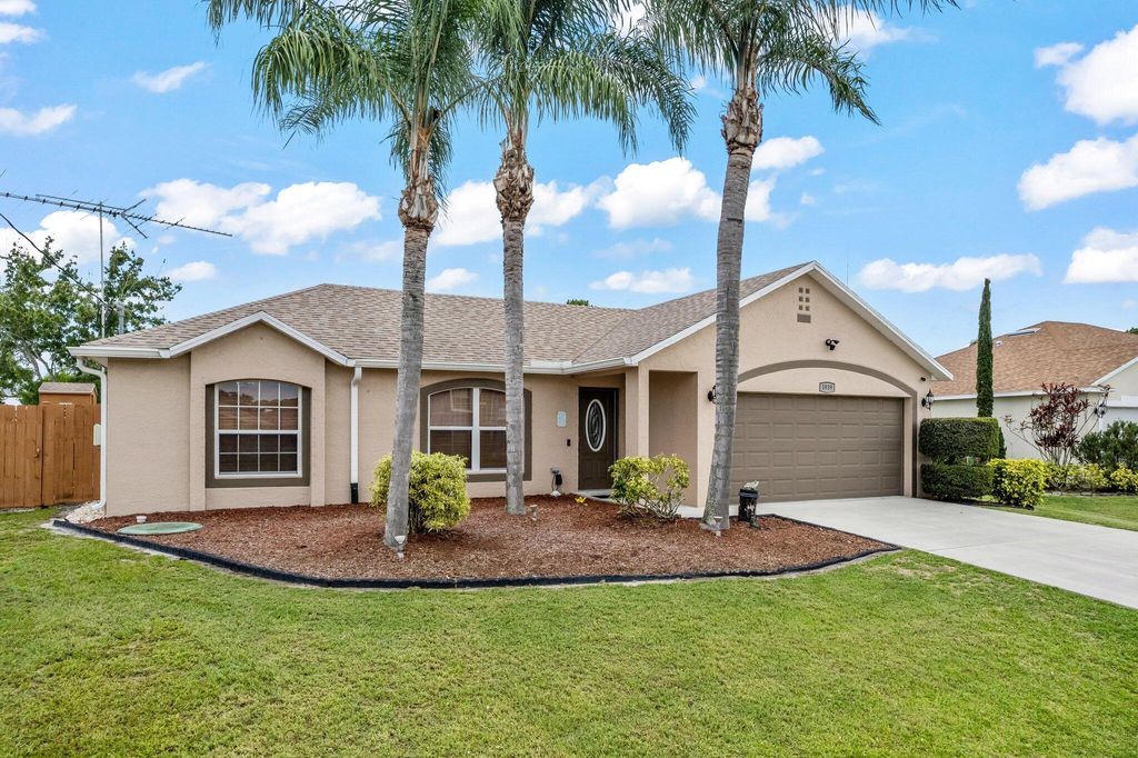 Photo of 5939 NW Center Street, Port Saint Lucie, FL 34986 (MLS # R10997482)