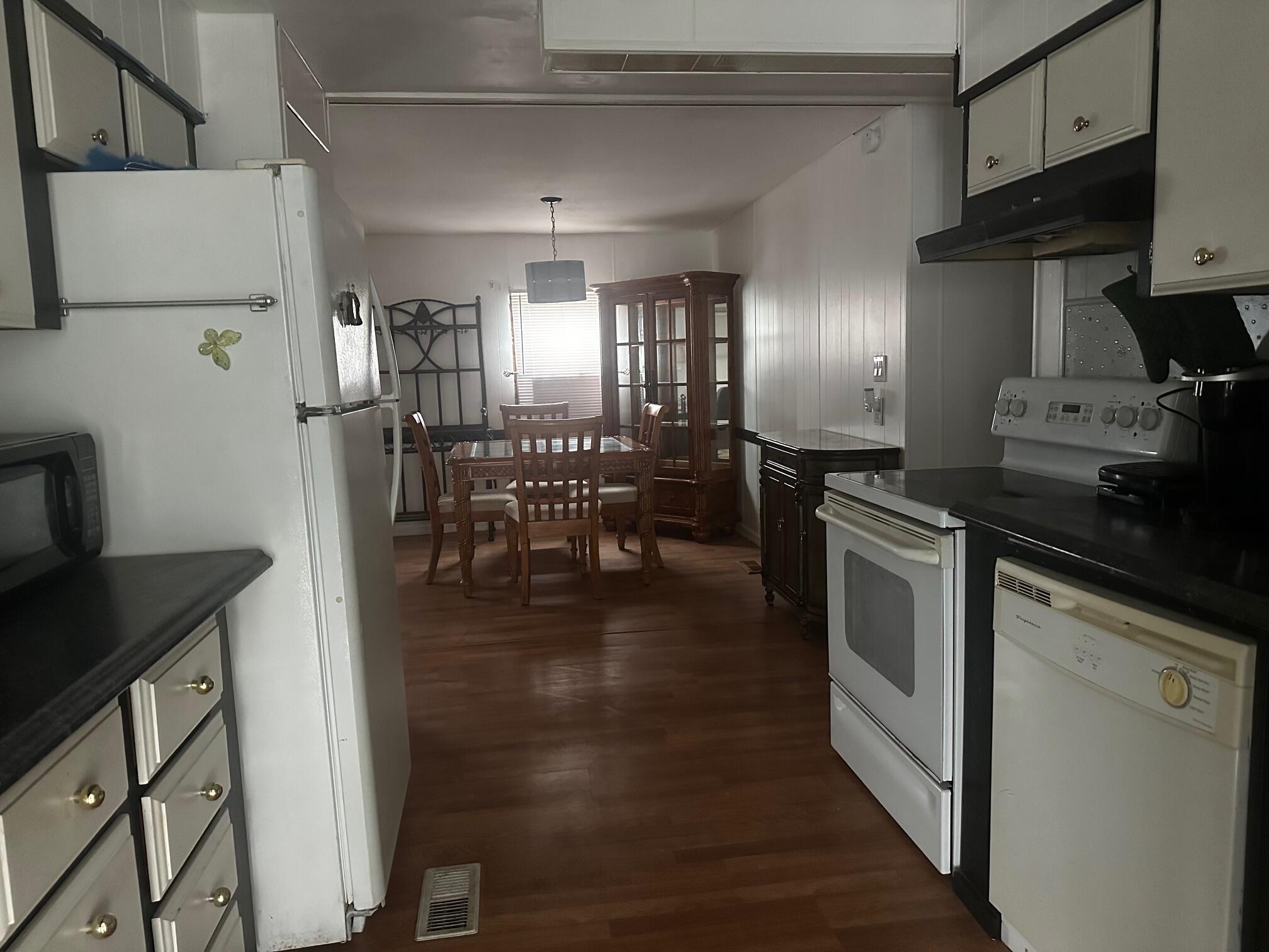 Welcome home Seniors to this perfect community with a 9 hole private golf course, 2 swimming pools, tennis, pickle ball and 45 other activities. This home is located just minutes to the warm water beaches in Jensen Beach. Also, lots of shopping, restaurants, theatre, hospital and more. The full home air conditioner was replaced in 2022 and the interior and exterior were completely painted recently. The price has had a drastic price reduction to $29,900 for a quick sale. Cash offers only. Easy transfer to new owner. Homes on this street are almost all owned by owners with no rentals. Bring offers!!