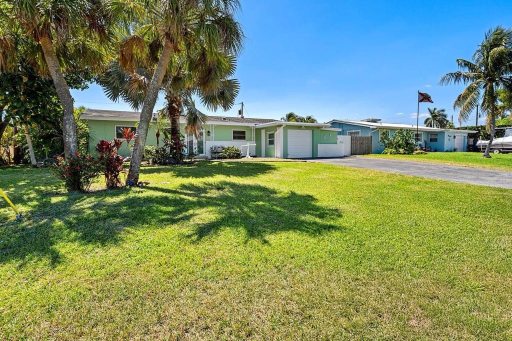 Photo of 430 NE 43RD Street, Boca Raton, FL 33431 (MLS # B26082817)