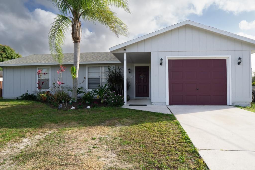 Photo of 686 SW Violet Avenue, Port Saint Lucie, FL 34983 (MLS # R10777878)