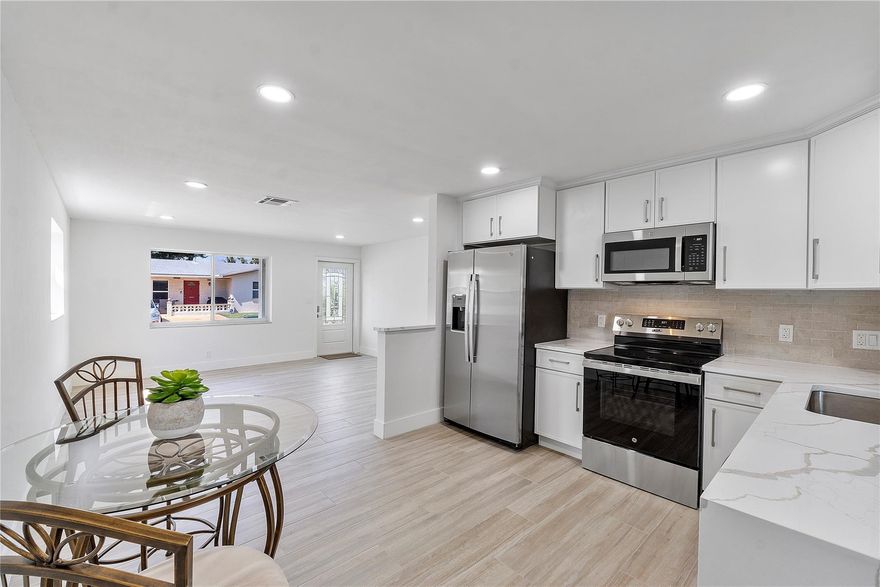 Welcome Home!!! Step into comfort and confidence with this beautifully update 2-bedroom, 1-bath single family home in Tamarac. Its the perfect blend of style, security, and affordability. Bright modern kitchen with Quartz countertop, all new stainless steel finish GE appliances. bedrooms closets with organizers, NEW SHINGLE ROOF with warranty. New hurricane impact front door and back door. Accordion shutters, All new interior doors. Sleek porcelain tile throughout. 15x14 Living room, 16X11 Family room. Private back yard with Mature Mango, Ackee tree and Avocado trees. Screened in patio. Low monthly HOA fee of 115. covers lawn care, Community pool and Clubhouse. **ALL AGES AND PET FRIENDLY**