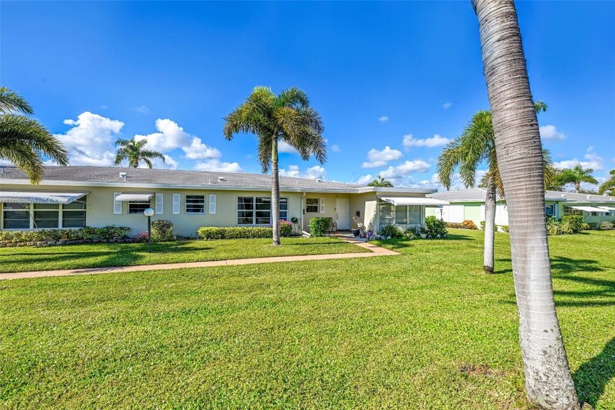 Enjoy the best of South Florida living in this 1-bedroom, 1.5-bath with den, located at Pine Point Villas. 55+ community. This villa-style home offers the feel of a single-family residence with a bright, freshly painted interior and spacious layout. Pride of ownership is evident throughout both the home and the well-kept community. Features include new track lighting, two walk-in closets, renovated bathrooms with a step-in shower. Recently refurbished kitchen cabinets. Florida room ideal for guests, a den, or a home office. Major updates completed in 2021 include the central A/C, electrical panel, roof, and exterior building paint. Conveniently located near shopping, dining, movie theaters, beaches, and major highways. Furniture negotiable. Move-in ready.