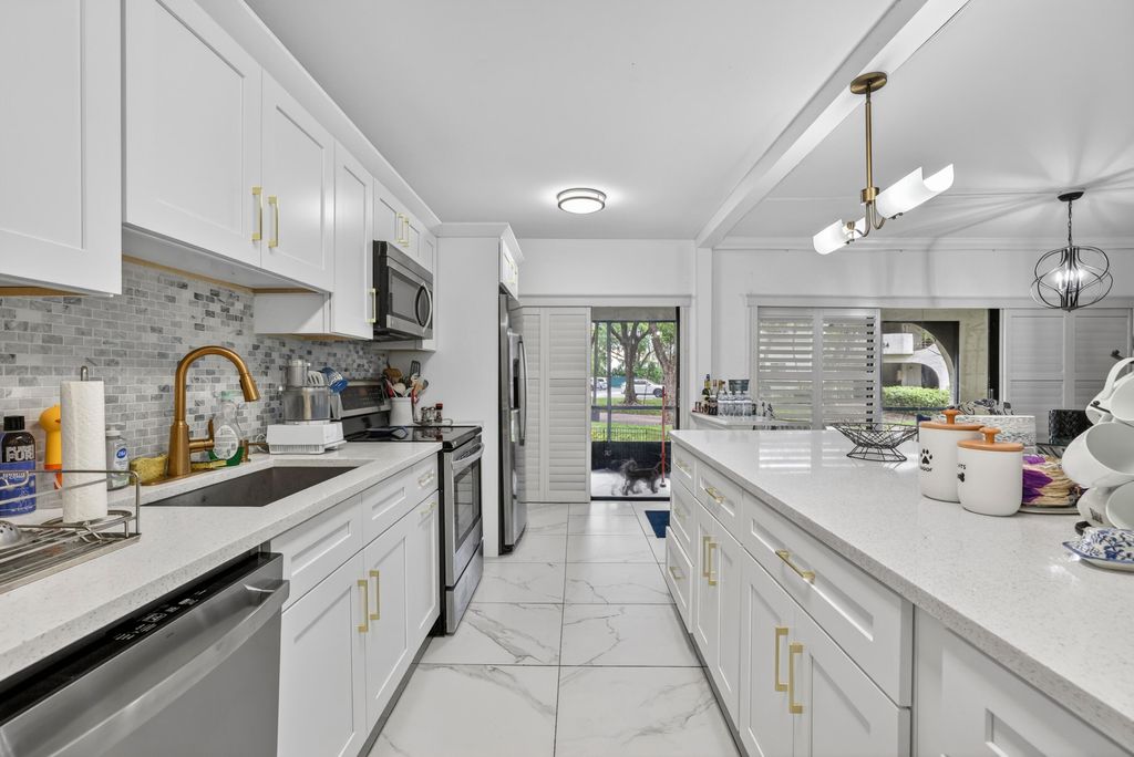Photo of 6328 W Longboat Ln Lane W #101, Boca Raton, FL 33433 (MLS # B26027185)