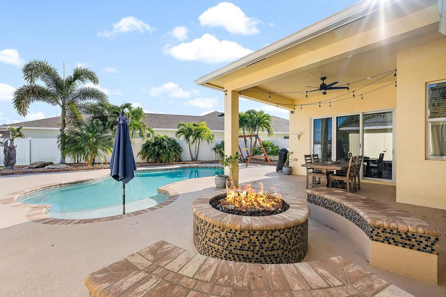 Leased until May 31, 2026. This 3-bedroom home, with flexible den or fourth bedroom, along with 2 full bathrooms comes complete with a plethora of upgrades: Solar powered saltwater pool with water fountains, a sun shelf, and solar heated. Newly installed turf for a maintenance-free lawn and perfect for pets. A covered patio with a custom-built gas fire pit and stone seating. This expansive backyard has space for a potential summer kitchen, cabana bathroom, or tiki bar complete with a gas hookup. Features include complete impact windows,  luxury vinyl plank (LVP) flooring with 5'' baseboards, Stainless appliances, with gas cooktop, wall ovens, alkaline water filtration system, and LG Thinq front-loading washer and dryer with utility sink. The primary suite offers a cozy nook perfect for an office, nursery, or reading area. The ensuite features dual sinks, his-and-hers walk-in closets with organizers, and a large tiled walk-in shower. The three car garage features a built out attic for ample storage and an additional 3 feet added to driveway pavers on each side for larger vehicles, trucks and toys. This home and community has precedence with Primrose private school that is a short walk or golf cart ride around the corner. 
Located just a short walk to Tradition Square, you'll enjoy a vibrant lifestyle with excellent dining, shopping, and recreation options. With easy access to I-95 and the Cleveland Clinic, this home offers unmatched convenience. The HOA fee at Bedford Park includes community pool, landscaping, pest control, lawn maintenance, cable, high-speed internet. Tradition's cheerful Town Center reimagines small town living with fresh, modern amenities and experiences without sacrificing nostalgic charm and close-knit community - where residents can start a new life chapter filled with opportunities to learn, grow, and create new memories. This area creates a natural community hub for residents to meet and socialize, where events like a weekly farmers market invite one and all to gather. An adjacent amphitheater brings an entertainment venue to Tradition for year-round community enjoyment of performances such as concerts, theater, dance, comedy, and more.