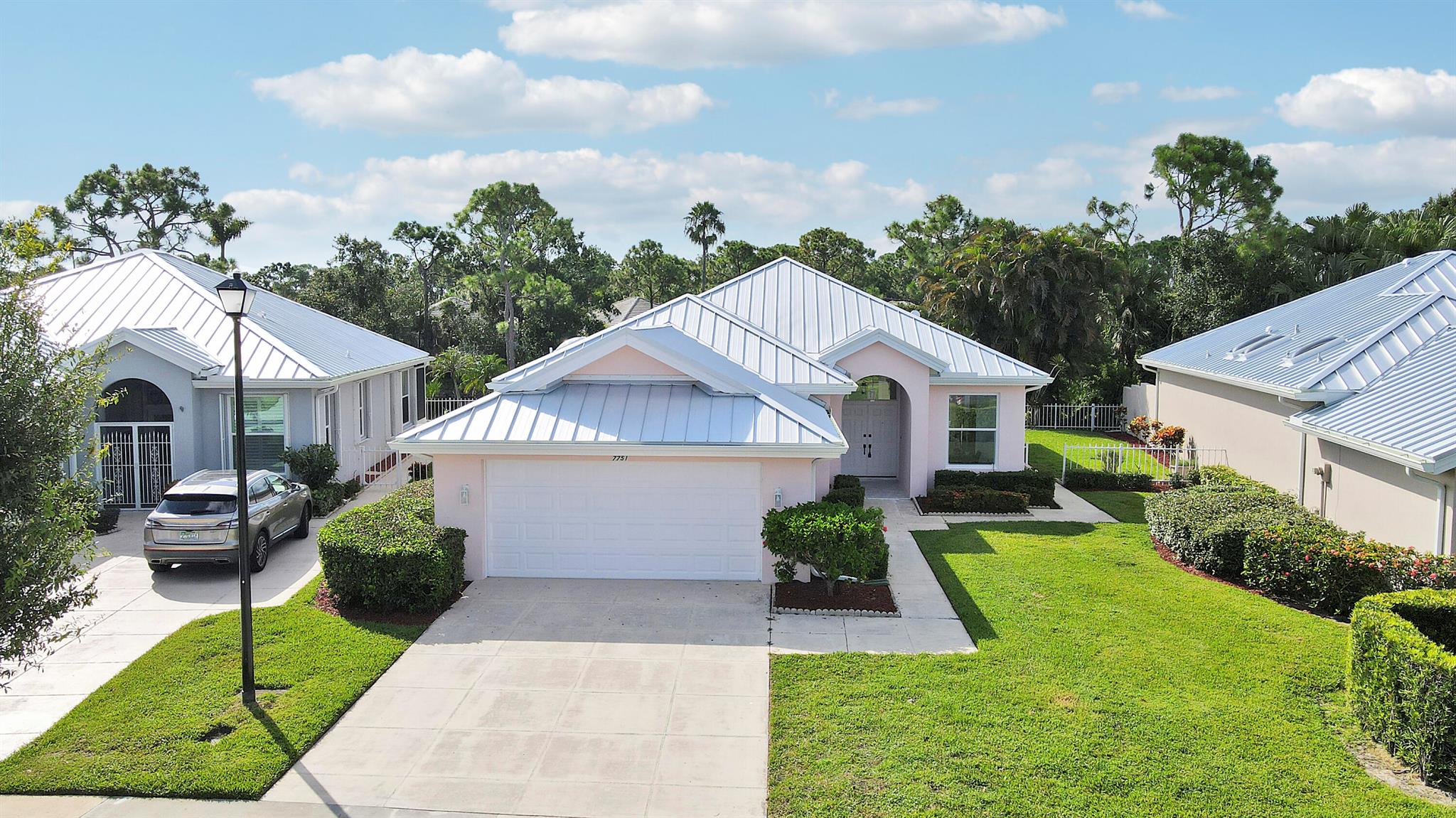 Fully renovated home in The Preserve of Hobe Sound featuring a new metal roof, impact windows, soaring ceilings, and a sleek modern design. This light-filled home offers an open-concept layout with designer finishes and clean lines throughout. Enjoy beautiful water views from the main living areas and primary suite. The partially fenced yard is perfect for pets or entertaining, with space to relax or add a pool. Located in a gated community with low HOA fees, just minutes from beaches, golf, and dining. A rare turnkey opportunity in one of Hobe Sound's most sought-after neighborhoods.