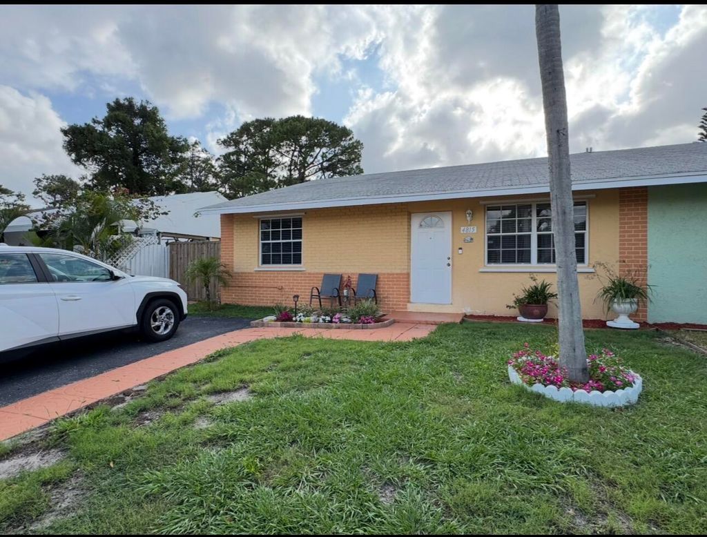 Photo of 4815 Gladiator Circle, Greenacres, FL 33463 (MLS # B26024198)