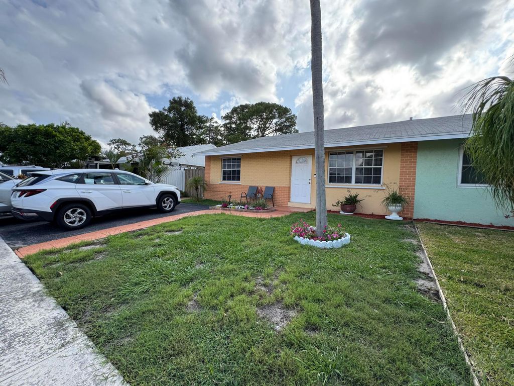 Photo of 4815 Gladiator Circle, Greenacres, FL 33463 (MLS # B26024198)