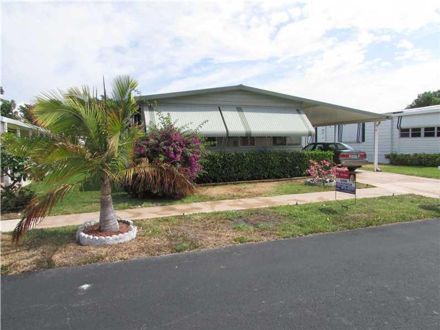 WELL MAINTAINED 24X48 MOBILE HOME, UPDDATED KITCHEN WITH TILE FLOORING, WOOD LAMINATE THRU-OUT THE HOME. A/C NEW IN 2006, FRONT, RAISED PATIO ENCLOSED WITH CENTRAL A/C AND IMPACT FRENCH DOORS. SOLD UNFURNISHED, AS-IS WITH RIGHT TO INSPECT. ADULT, GATED MO BILE HOME COMMUNITY WITH CLUBHOUSE, HEATED POOL AND SOCIAL ACTIVITIES.